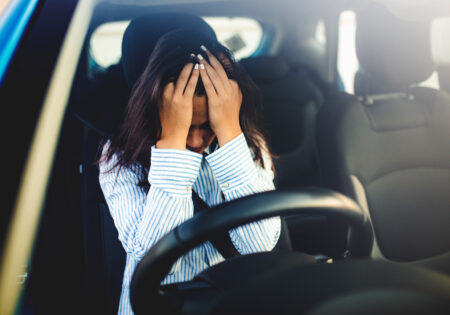 Sad businesswoman driver sitting in car